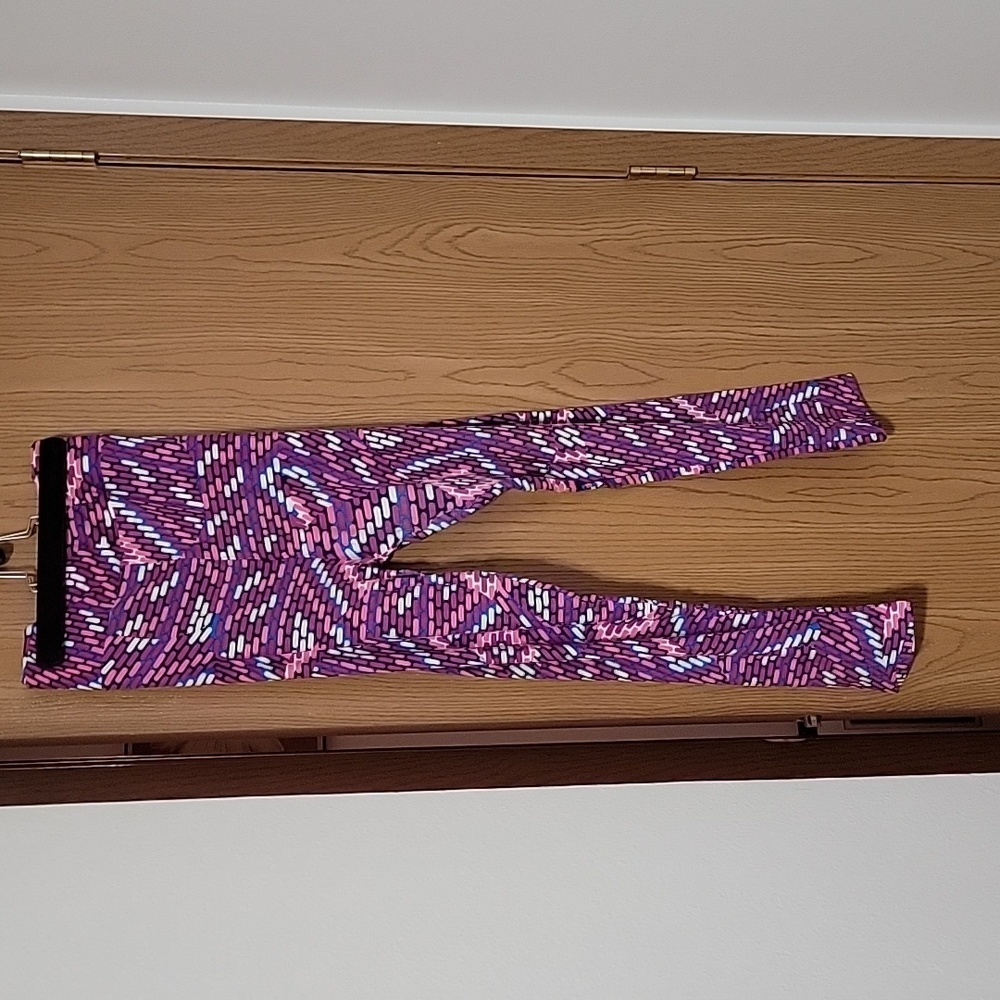 Tc2 lularoe pink, white, blue, purple and black geometric leggings.